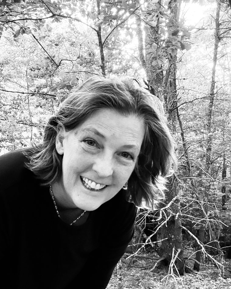 Dakota Earth Cloud Walker smiling among bare winter trees